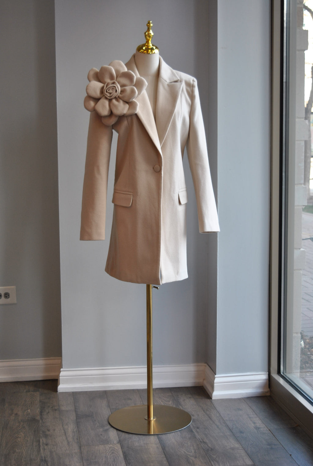 LIGHT BEIGE SPRING COAT WITH A FLOWER