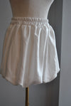 WHITE MINI SILKY MINI SKIRT