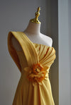 YELLOW LONG ASYMMETRIC EVENING GOWN WITH A FLOWER PIN