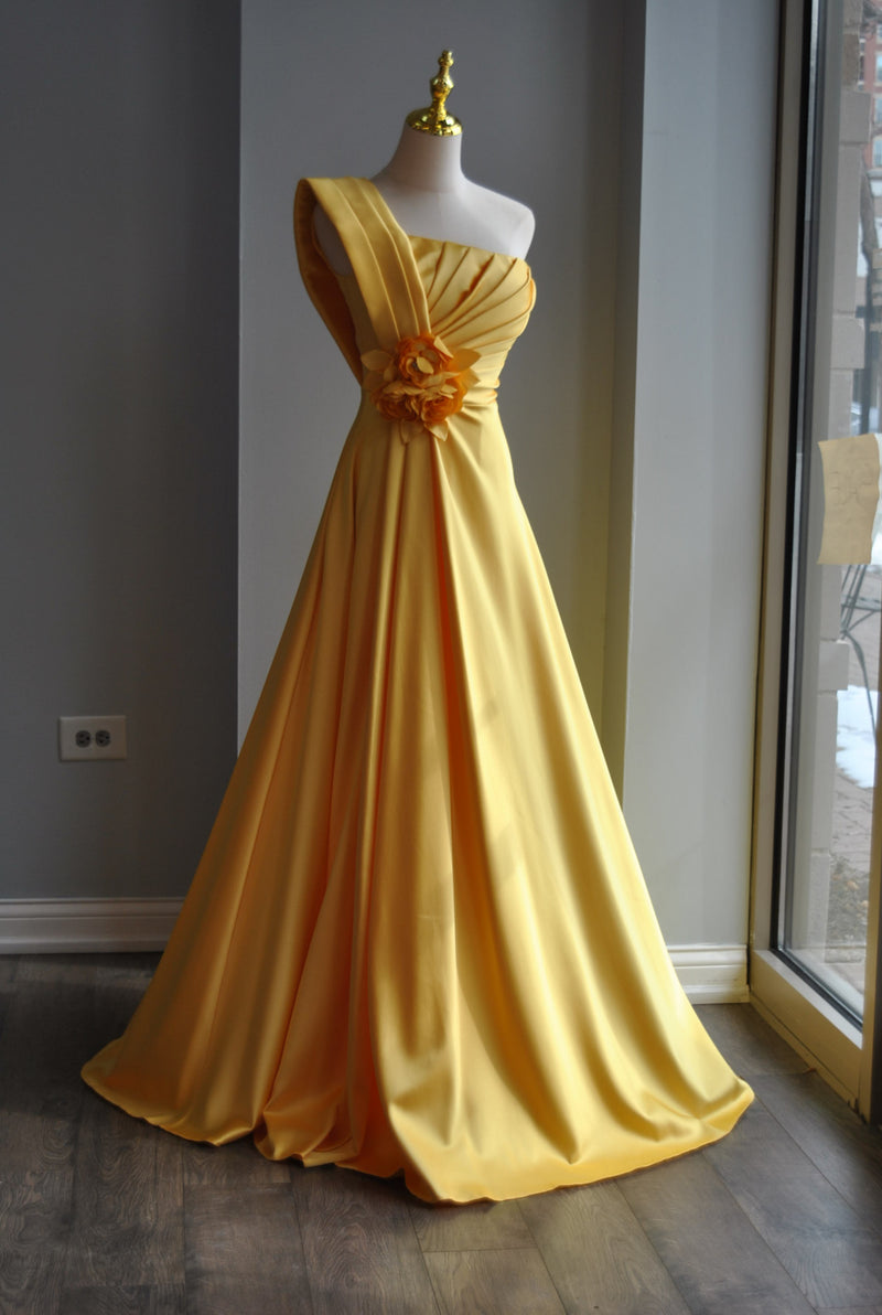 YELLOW LONG ASYMMETRIC EVENING GOWN WITH A FLOWER PIN