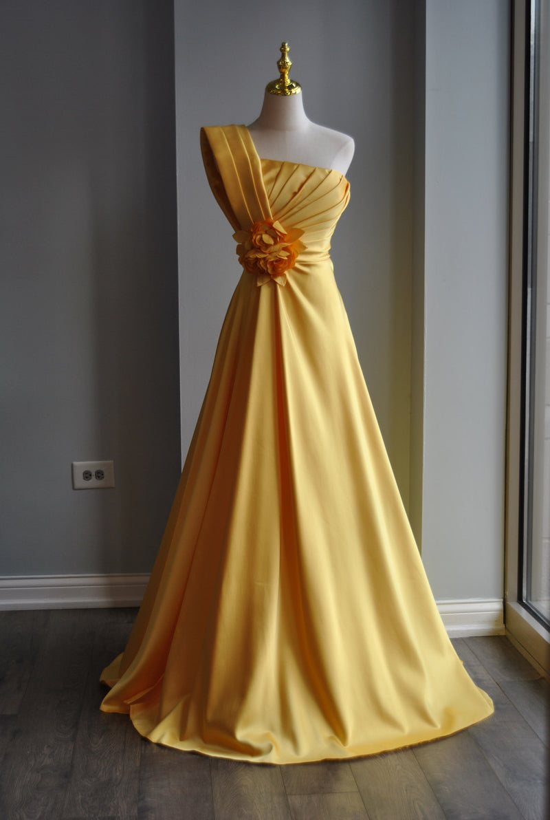 YELLOW LONG ASYMMETRIC EVENING GOWN WITH A FLOWER PIN