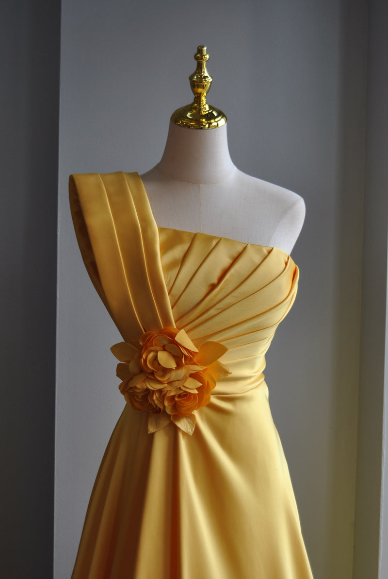 YELLOW LONG ASYMMETRIC EVENING GOWN WITH A FLOWER PIN